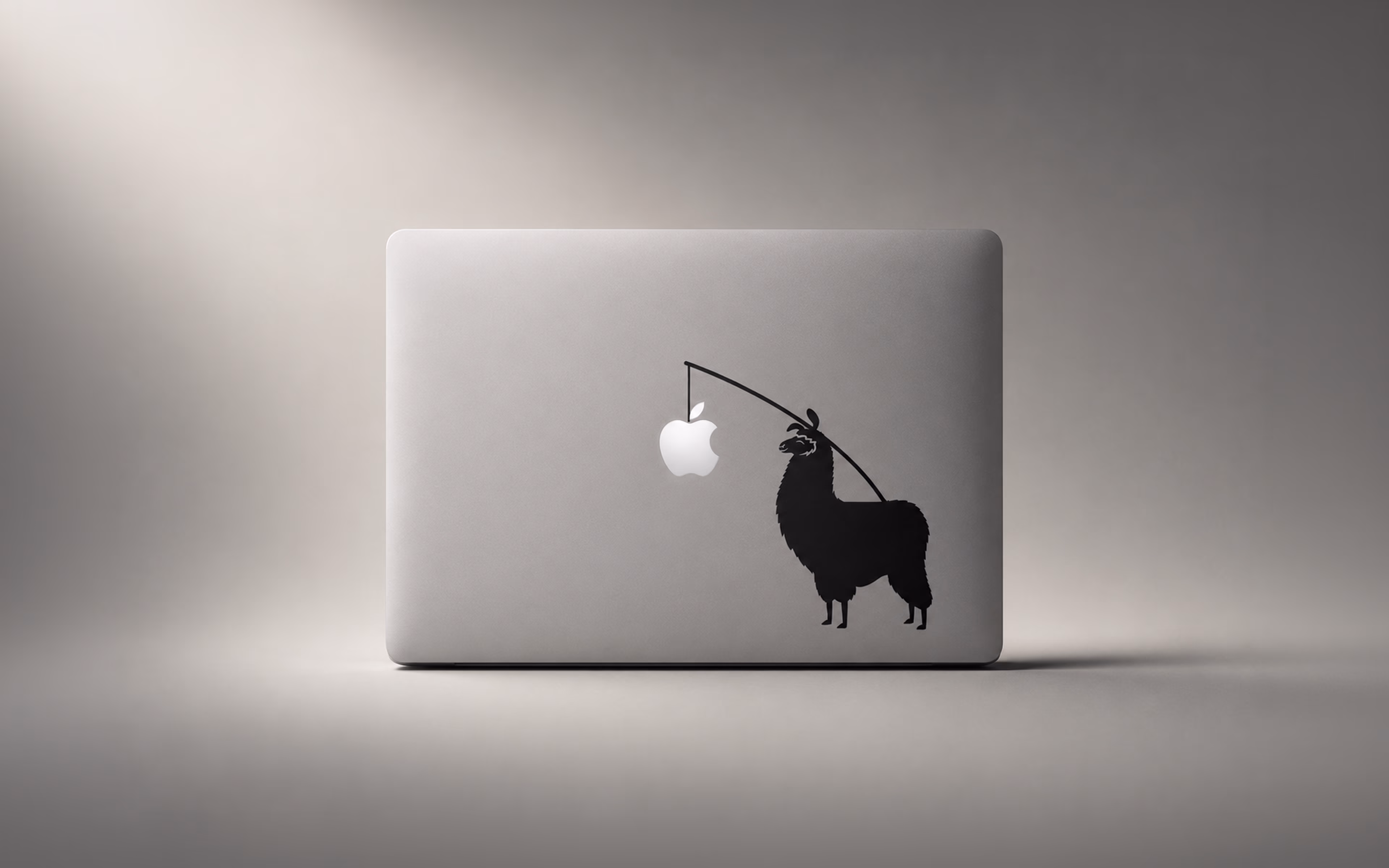 MacBook decal of a llama dangling the Apple logo as bait on a fishing rod
